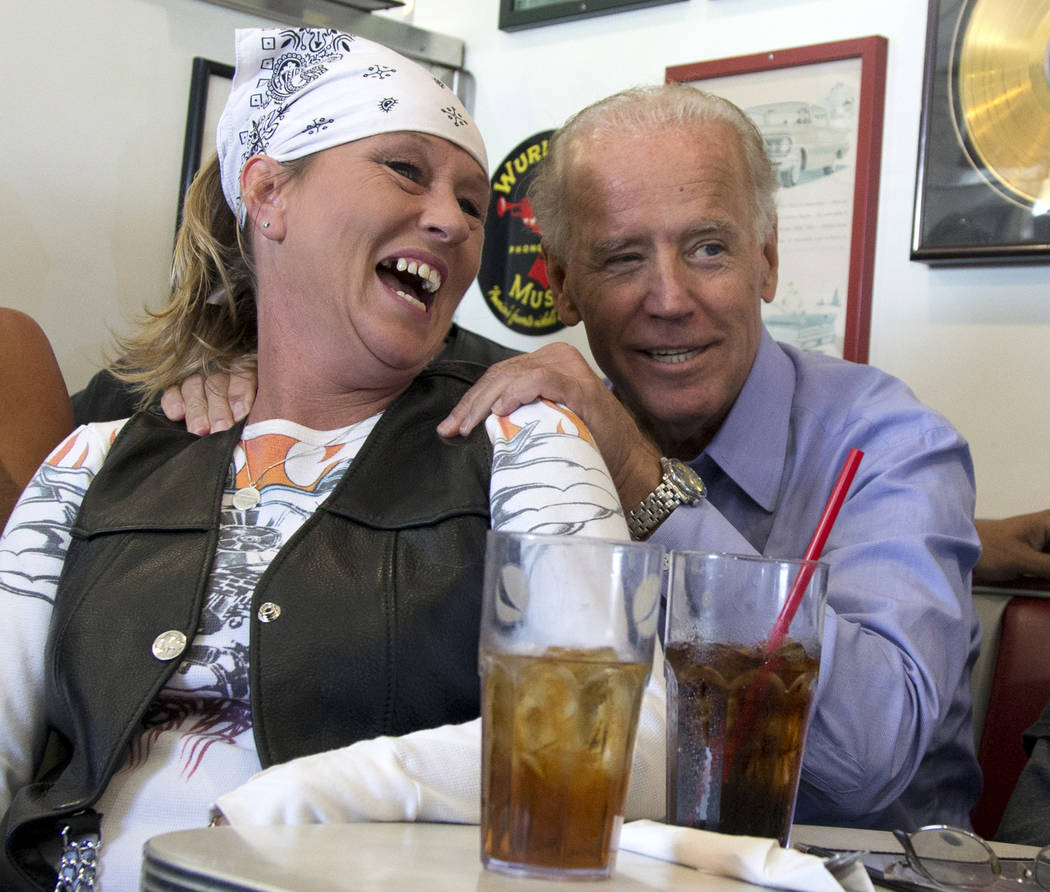 In this Sept. 9, 2012, photo, then-Vice President Joe Biden visits with patrons over lunch at C ...