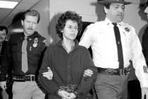 FILE - In this Nov. 24, 1981 file photo, Weather Underground member Judith Clark is handcuffed ...