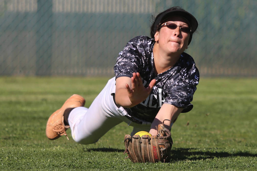Desert Oasis' Makayla Rickard makes a diving catch against Liberty in a softball game at Desert ...