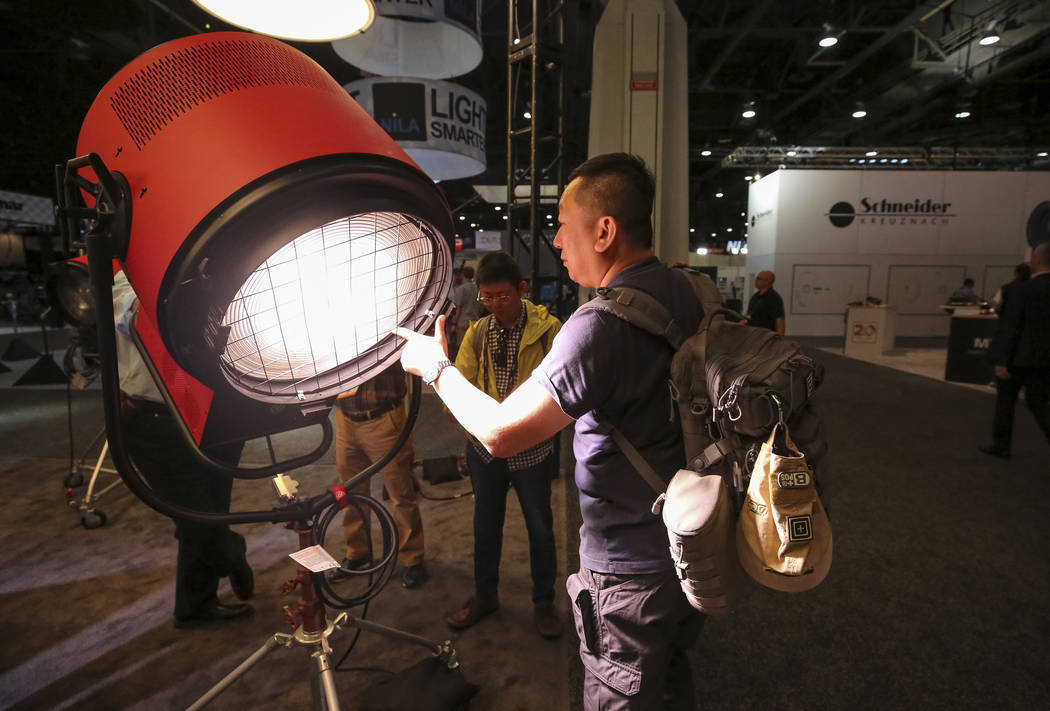 Filmmaker Paul Chou of Taiwan demonstrates Mole-Richardson's Vari-Tener 10k LED movie light dur ...
