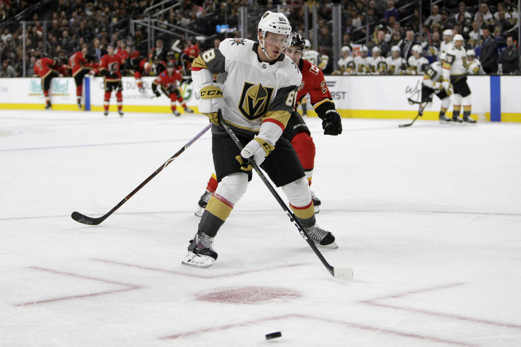 Vegas Golden Knights defenseman Nate Schmidt (88) vies for the puck during the second period of ...