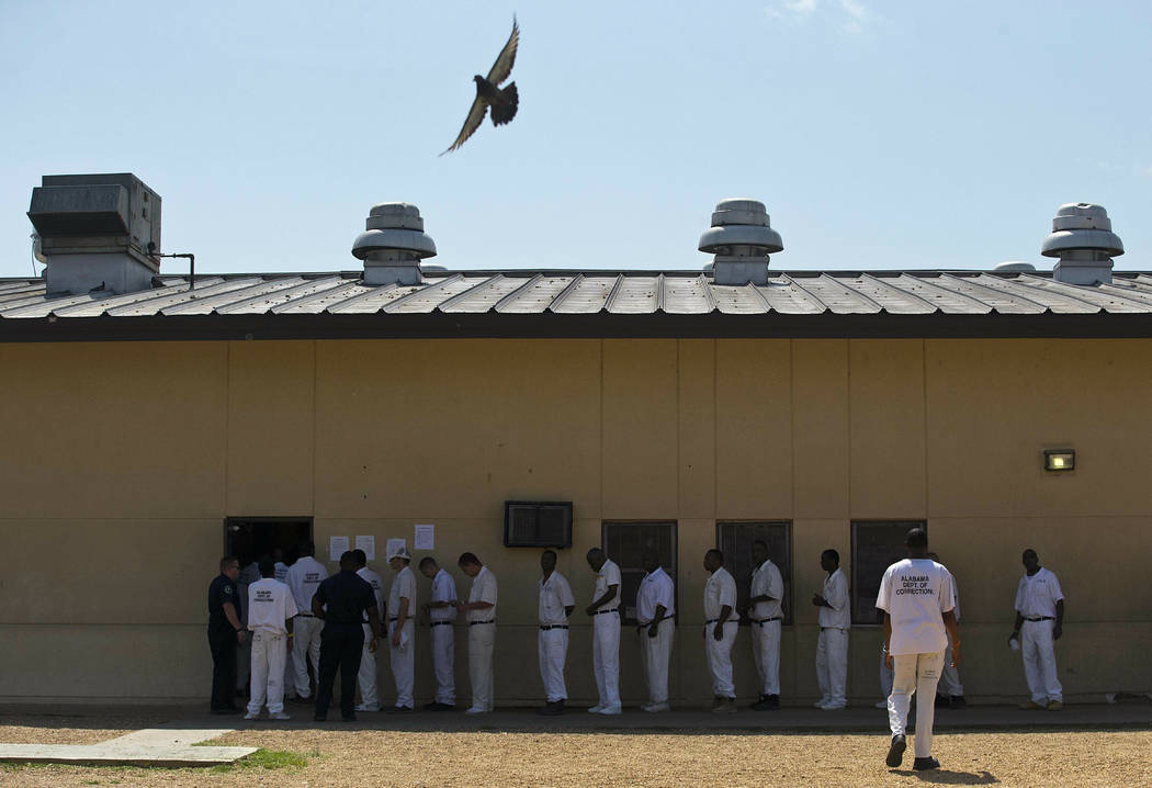 Prisoners stand in a crowded lunch line during a June 18, 2015, prison tour at Elmore Correctio ...