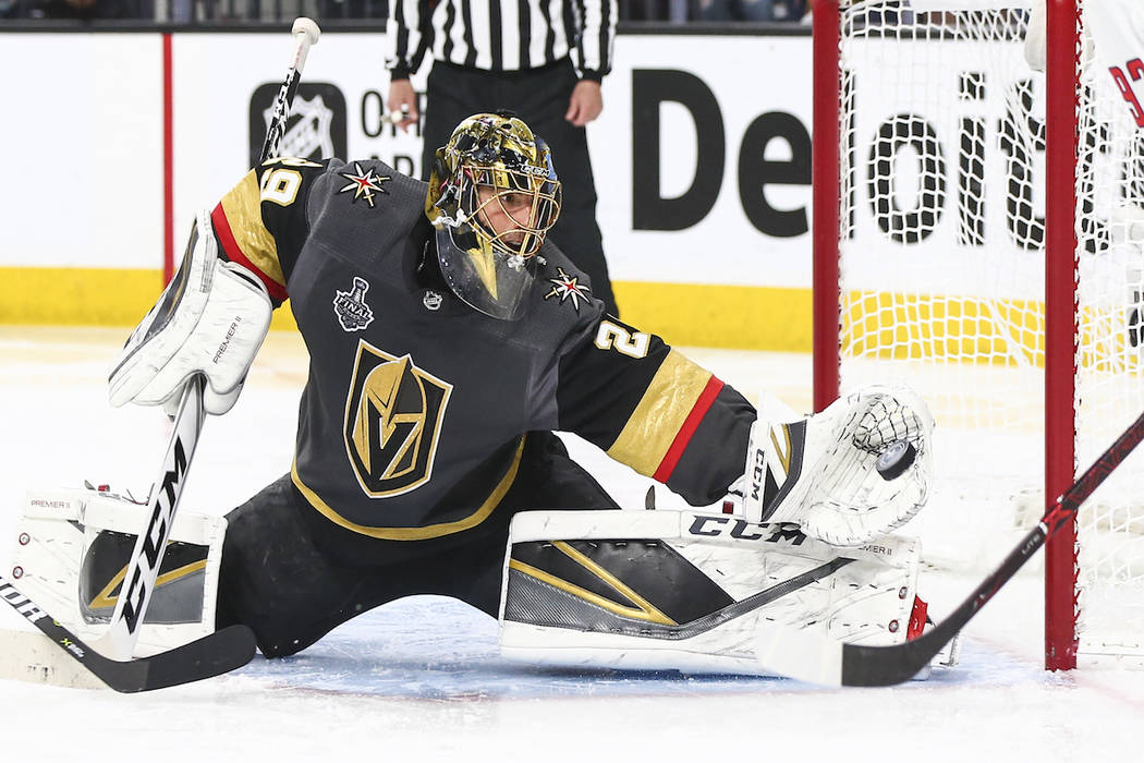 Golden Knights goaltender Marc-Andre Fleury (29) blocks a shot from Washington Capitals center ...