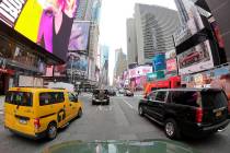 Motorists roll south on 7th Avenue in Times Square, Friday, March 29, 2019, in New York. A cong ...