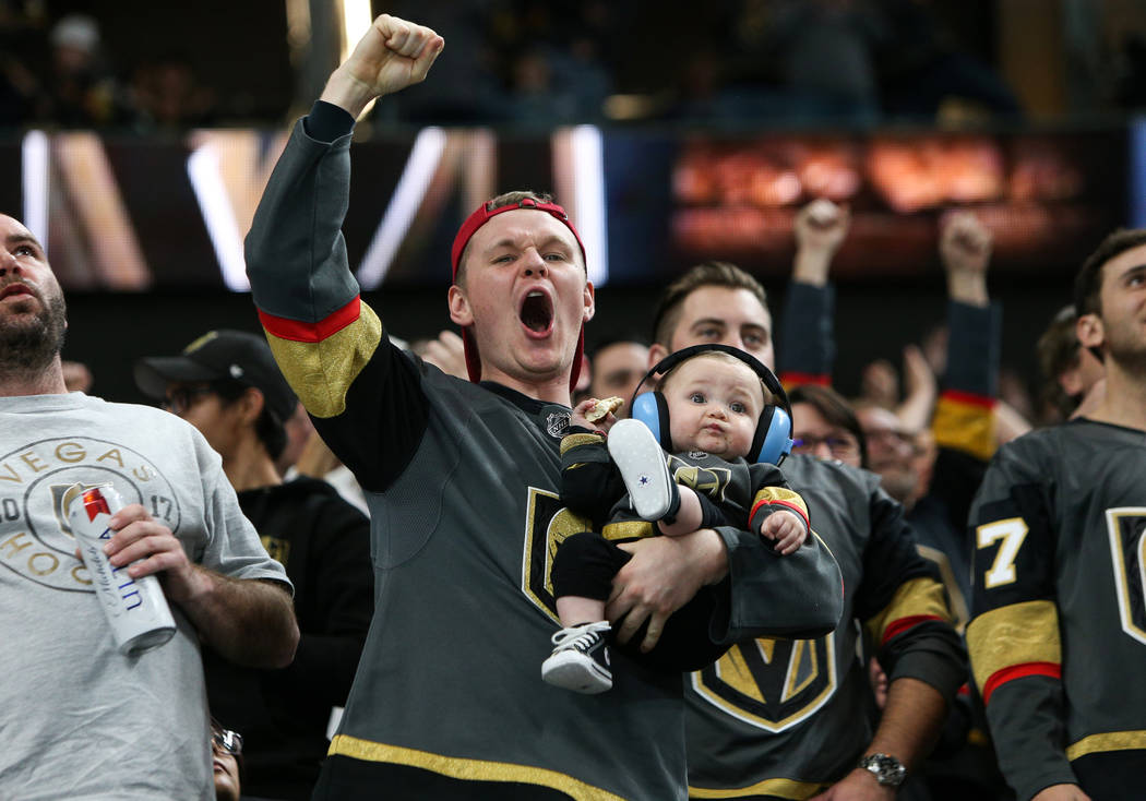 Fans cheer after Vegas Golden Knights center Ryan Carpenter (40) scores against the Vancouver C ...