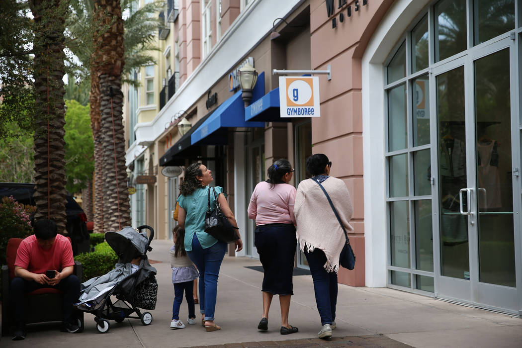 People walks at The District in Henderson, Thursday, April 4, 2019. Erik Verduzco Las Vegas Rev ...