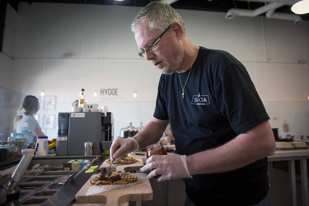 Owner Gert Kvalsund makes a nordic waffle at Saga Pastry + Sandwich in Las Vegas, Sunday, April ...