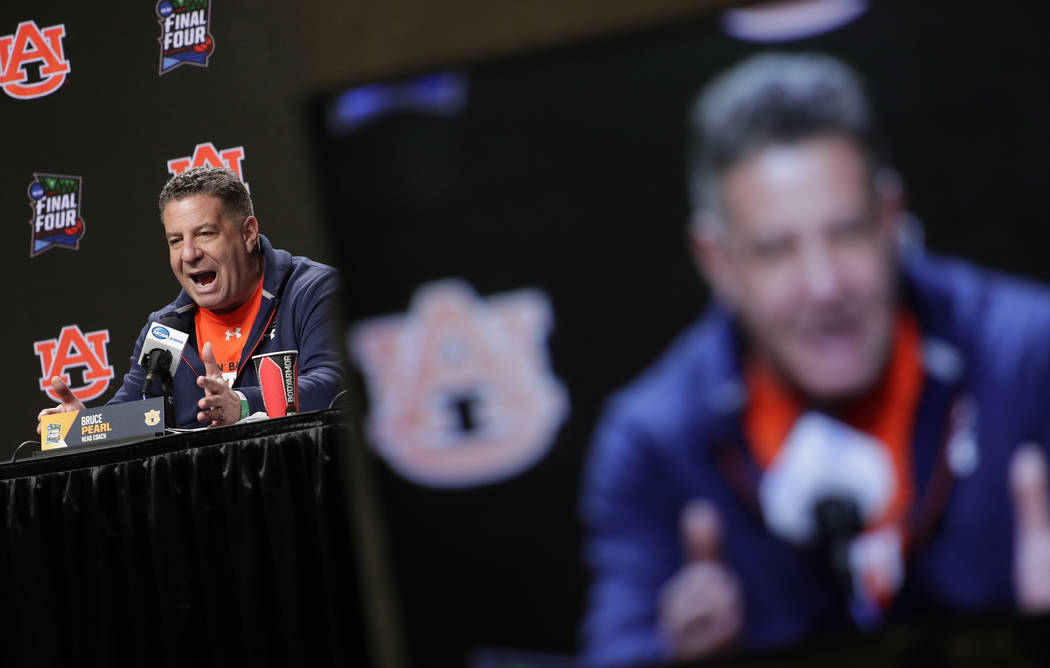 Auburn head coach Bruce Pearl answers questions after a practice session for the semifinals of ...