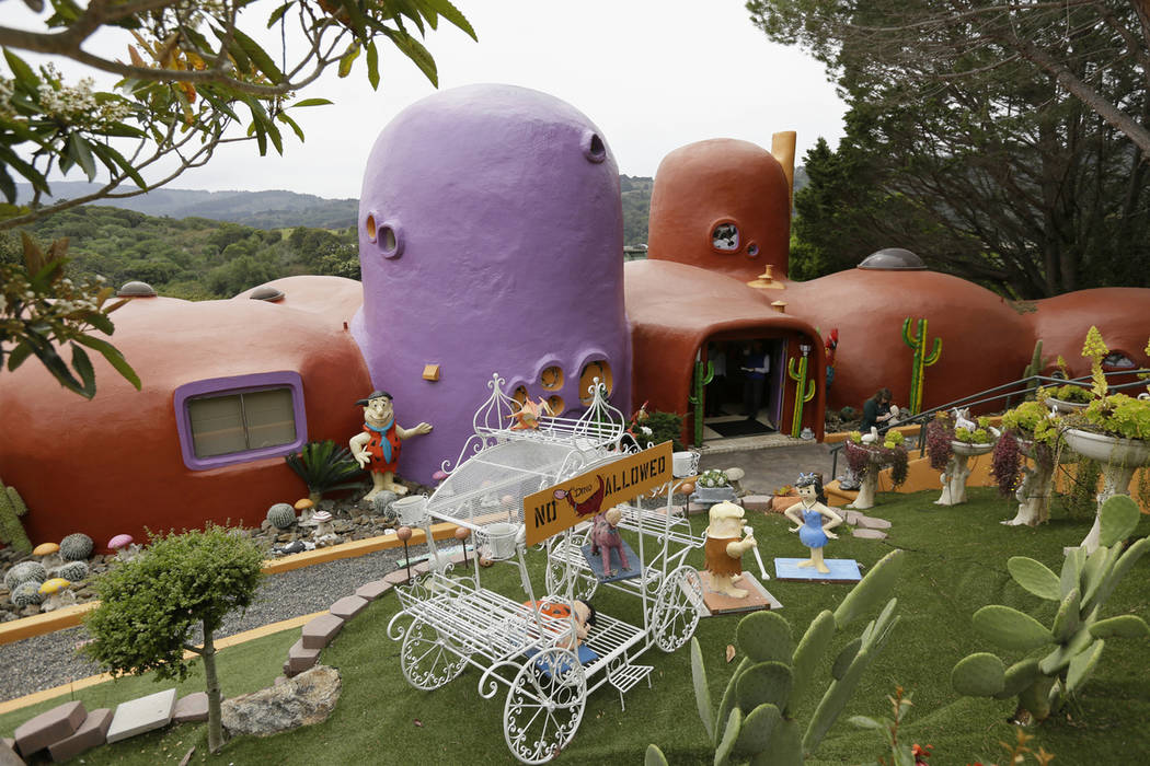 In this photo taken Monday, April 1, 2019, is an exterior view of the Flintstone House in Hills ...