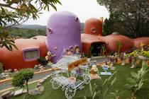In this photo taken Monday, April 1, 2019, is an exterior view of the Flintstone House in Hills ...