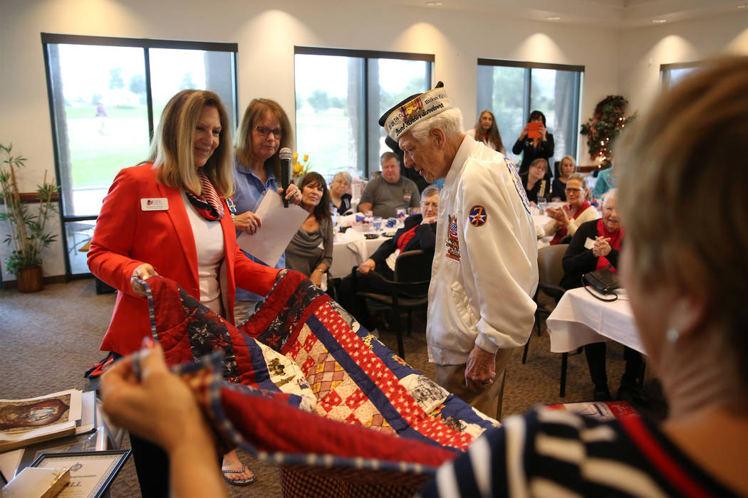 Pearl Harbor survivor Ed Hall, center, with Montyne Connolly, left, vice regent ...