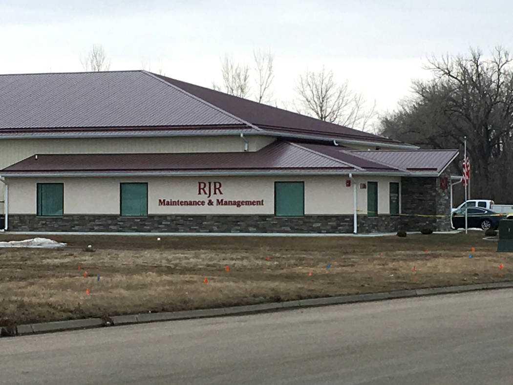 Cars are parked outside RJR Maintenance and Management in Mandan, N.D., on Monday, April 1, 201 ...