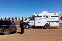 In this Wednesday, April 3, 2019 photo, state and local police search a field in Manton, N.D., ...