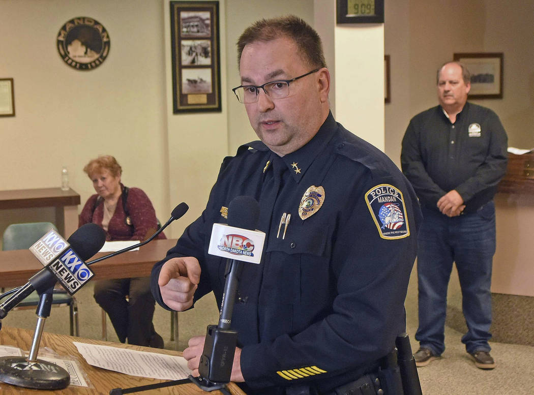 Mandan Police Chief Jason Ziegler announces an arrest in a quadruple homicide at a press confer ...