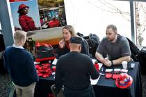 Visitors to a Pittsburgh veterans job fair meet with recruiters at Heinz Field on March 7, 2019 ...