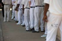 Prisoners stand in a lunch line during a prison tour at Elmore Correctional Facility in Elmore, ...