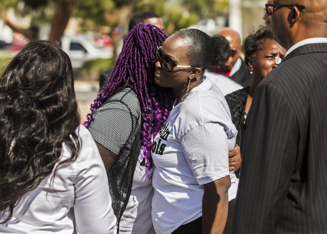 Friends and family of the victims console each other outside the Clark County Juvenile Justice ...