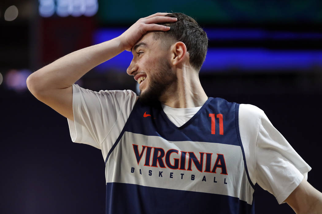 Virginia's Ty Jerome (11) reacts during a practice session for the semifinals of the Final Four ...