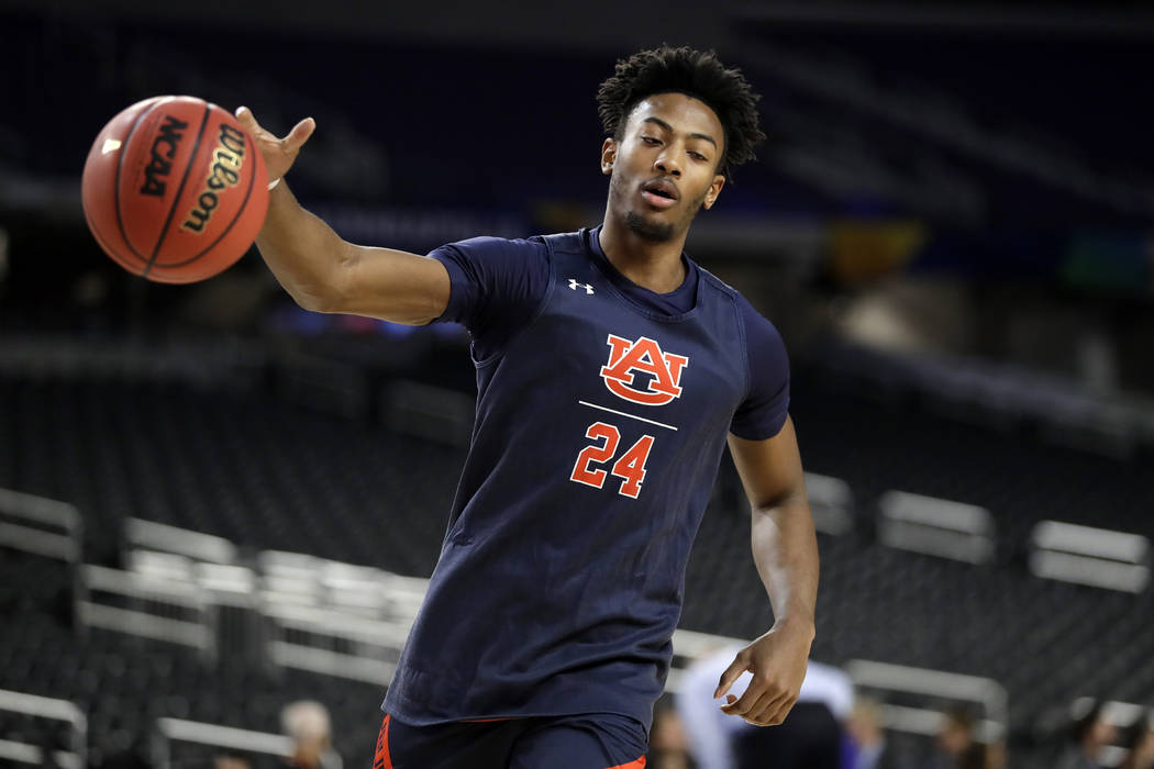 Auburn's Anfernee McLemore (24) warms up during a practice session for the semifinals of the Fi ...