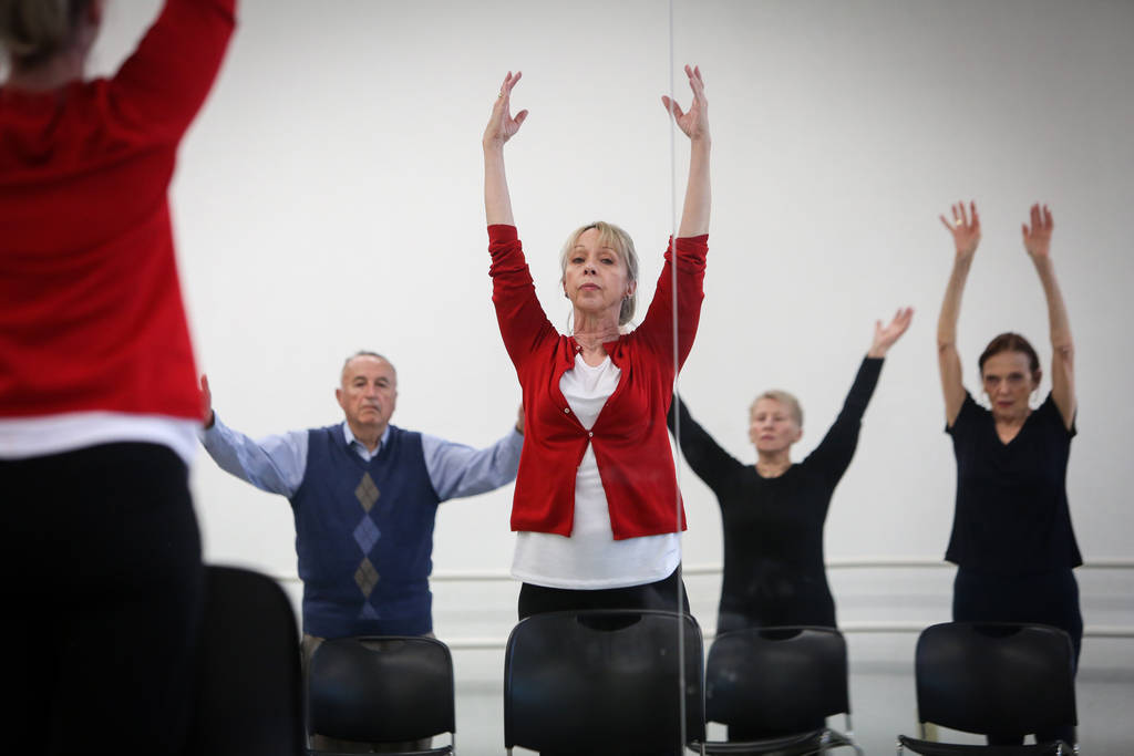 People participate in a ballet class for individuals with Parkinson's disease lead by Pamela La ...