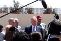 President Donald Trump visits a new section of the border wall with Mexico in Calexico, Calif., ...