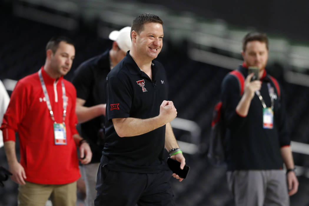 Texas Tech head coach Chris Beard pumps his fist during a practice session for the semifinals o ...