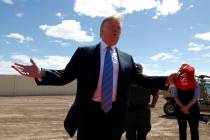 President Donald Trump visits a new section of the border wall with Mexico in Calexico, Calif., ...