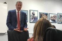 New York City Mayor Bill de Blasio speaks with local Culinary union members at their headquarte ...