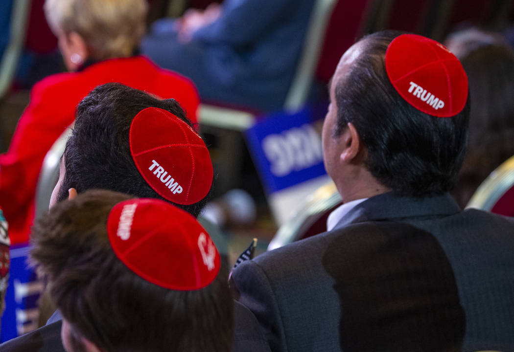 Attendees wear Trump yamakas as they await President Donald J. Trump to address the Republican ...