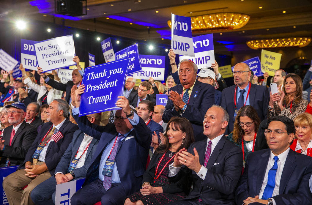 Attendees applaud as President Donald J. Trump completes his address to the Republican Jewish C ...