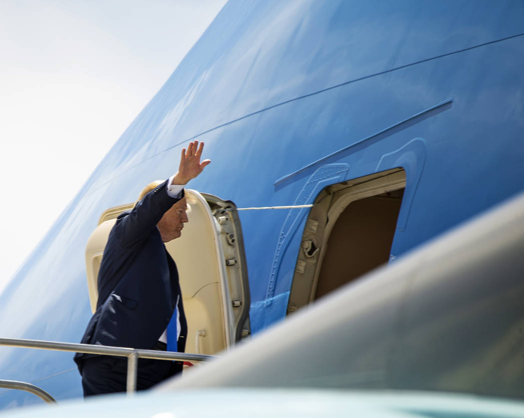 President Donald J. Trump waves as he readies to depart from McCarran International Airport on ...