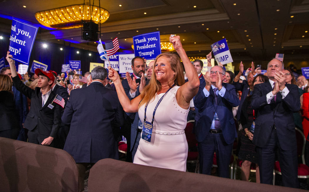 Attendees cheer and applaud as President Donald J. Trump leaves the stage after addressing the ...