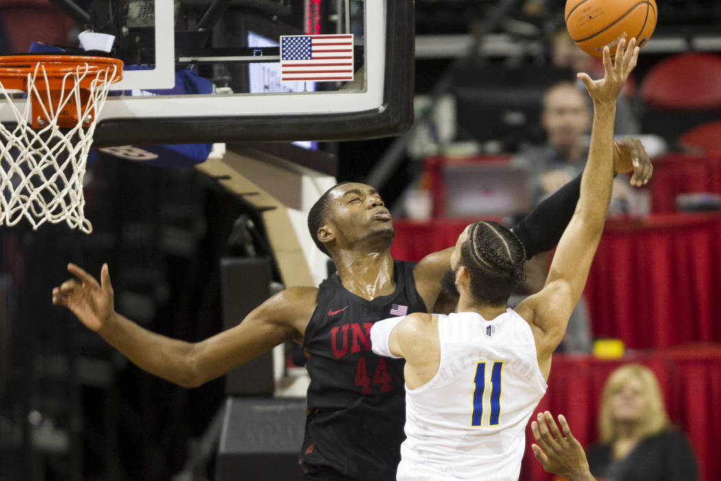 UNLV Rebels forward Brandon McCoy (44) blocks Nevada Wolf Pack forward Cody Martin (11) in the ...