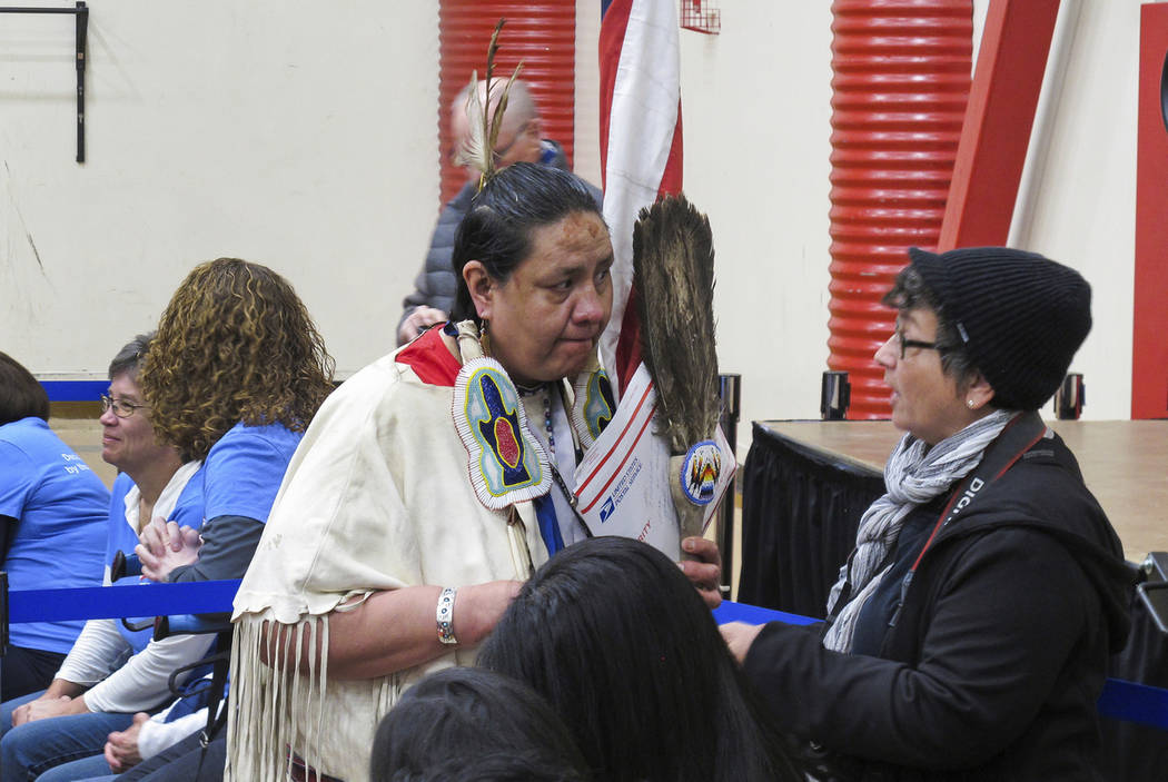 Joann Spotted Bear, a member of the Lakota Tribe, talks to a journalist before Sen. Elizabeth W ...