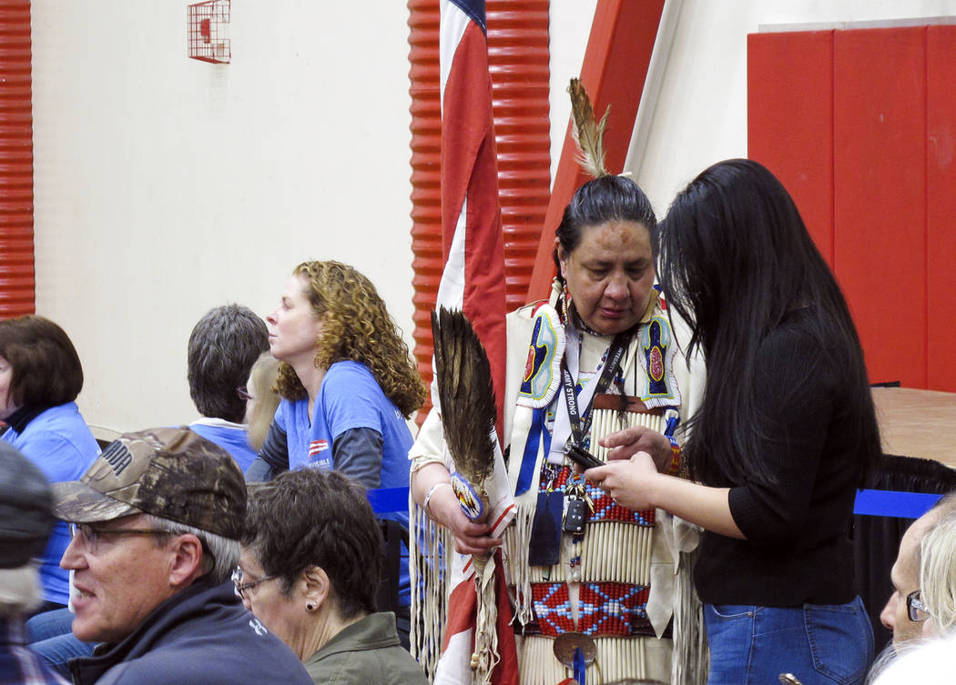 Joann Spotted Bear, a member of the Lakota Tribe, talks to a journalist before Sen. Elizabeth W ...