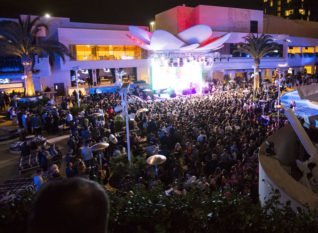 Attendees dance to Saint Jhn around the outdoor area the during the grand opening weekend of Ka ...