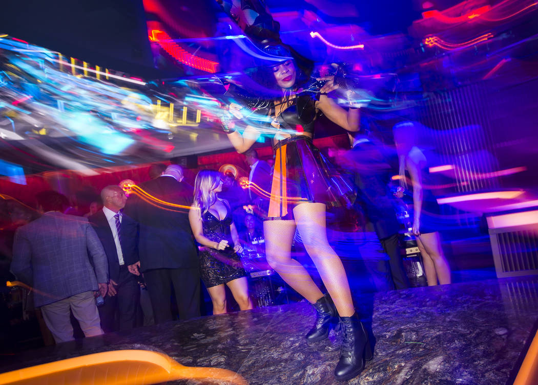 A dancer performs in the nightclub during the grand opening weekend of Kaos, the new dayclub an ...