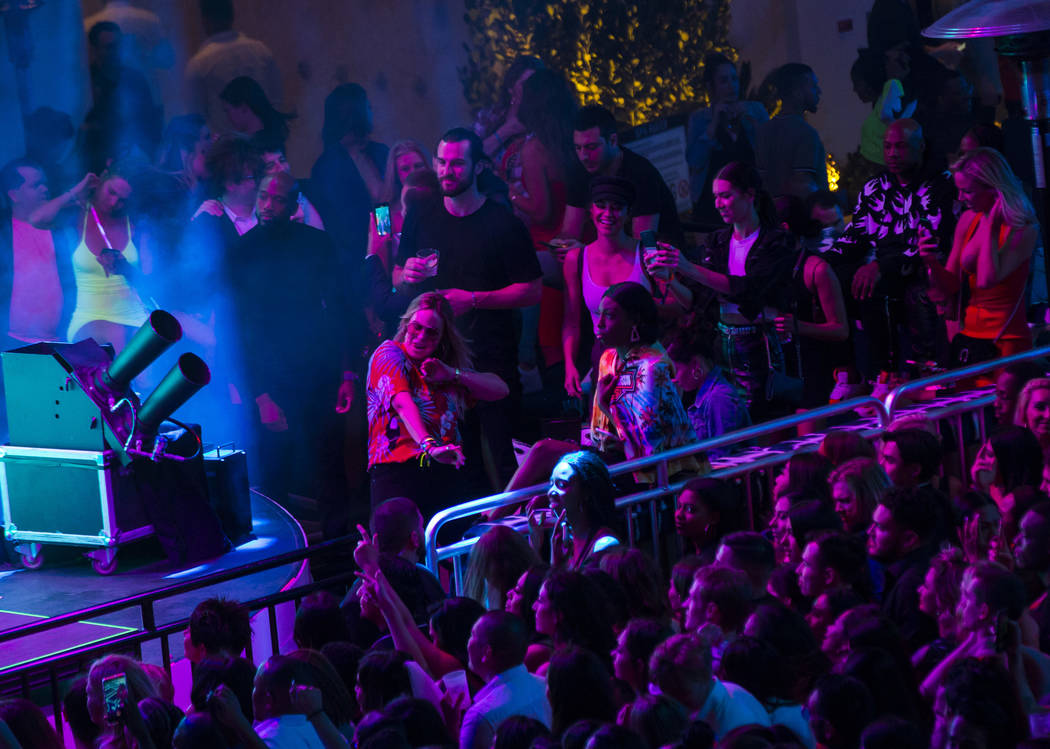 Attendees dance to Saint Jhn around the outdoor area the during the grand opening weekend of Ka ...