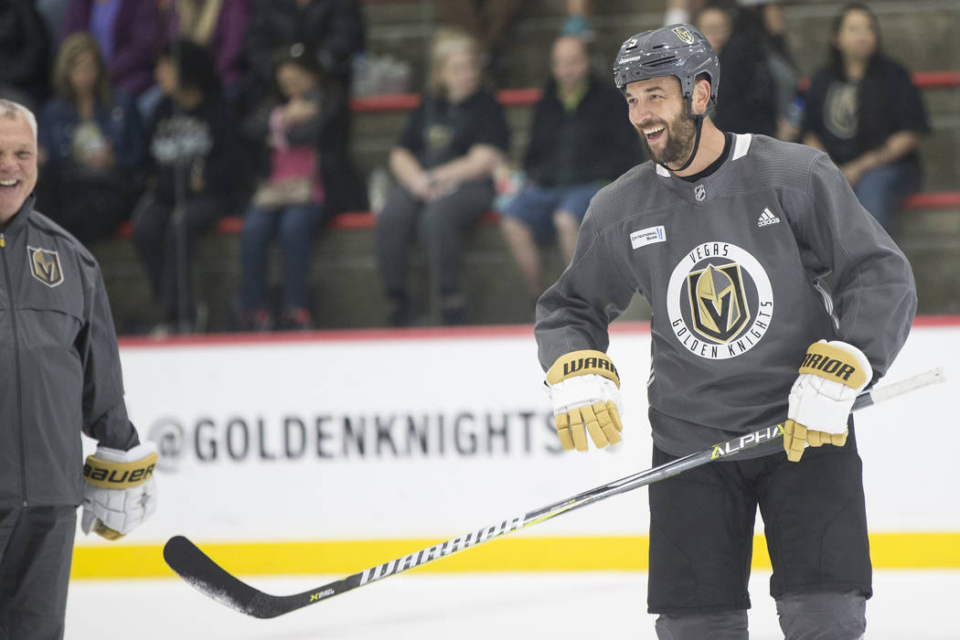 Golden Knights Deryk Engelland shares a laugh with teammates during practice on Wednesday, Oct. ...