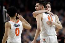Virginia's Kihei Clark (0), Ty Jerome (11) and Kyle Guy react during the second half in the sem ...