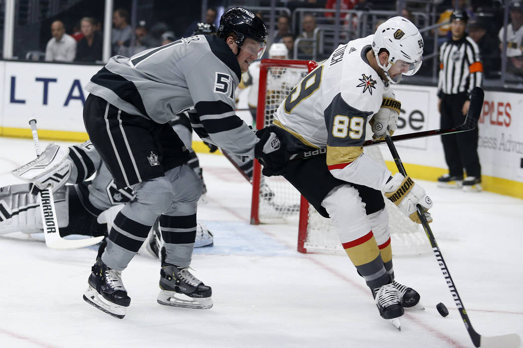CORRECTS BOTH IDS AND DESCRIPTION OF ACTION - Los Angeles Kings' Austin Wagner (51) defends aga ...
