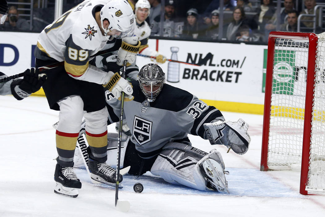 Los Angeles Kings goalie Jonathan Quick (32) stops a shot by Vegas Golden Knights forward Alex ...