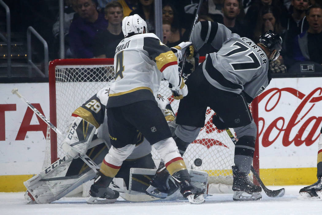 Los Angeles Kings forward Jeff Carter (77) scores on Vegas Golden Knights goalie Marc-Andre Fle ...