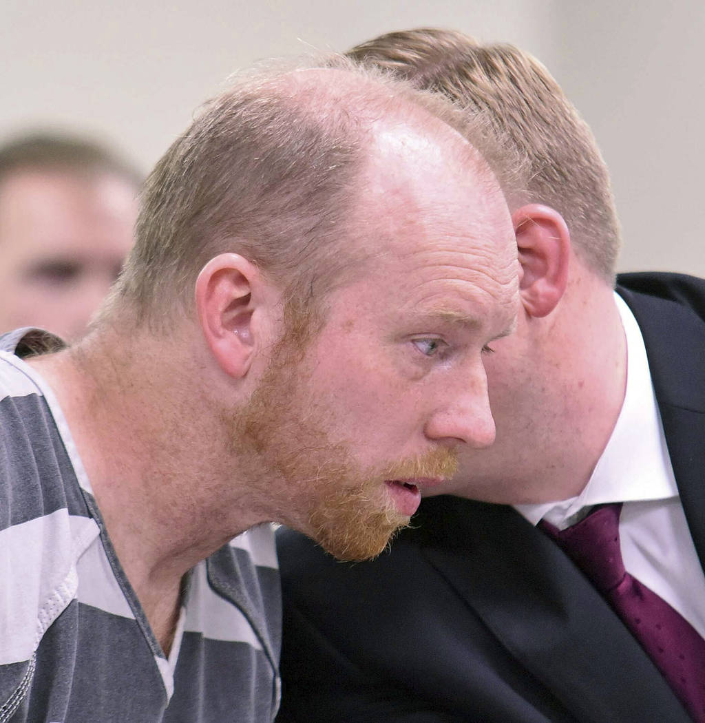 Chad Isaak listens to counsel in district court while being charged with four counts of class A ...