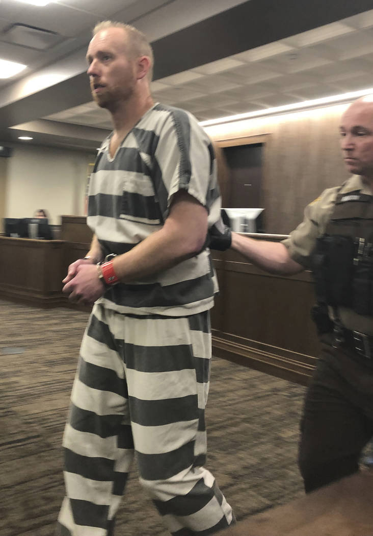 Chad Isaak, left, appears in court April 5, 2019, in Mandan, North Dakota. A judge set a $1 mil ...