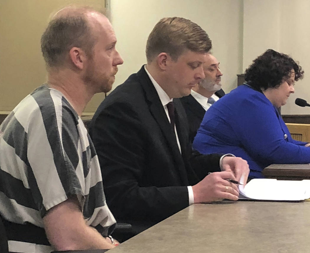 Chad Isaak, left, appears in court April 5, 2019, in Mandan, North Dakota. A judge set a $1 mil ...