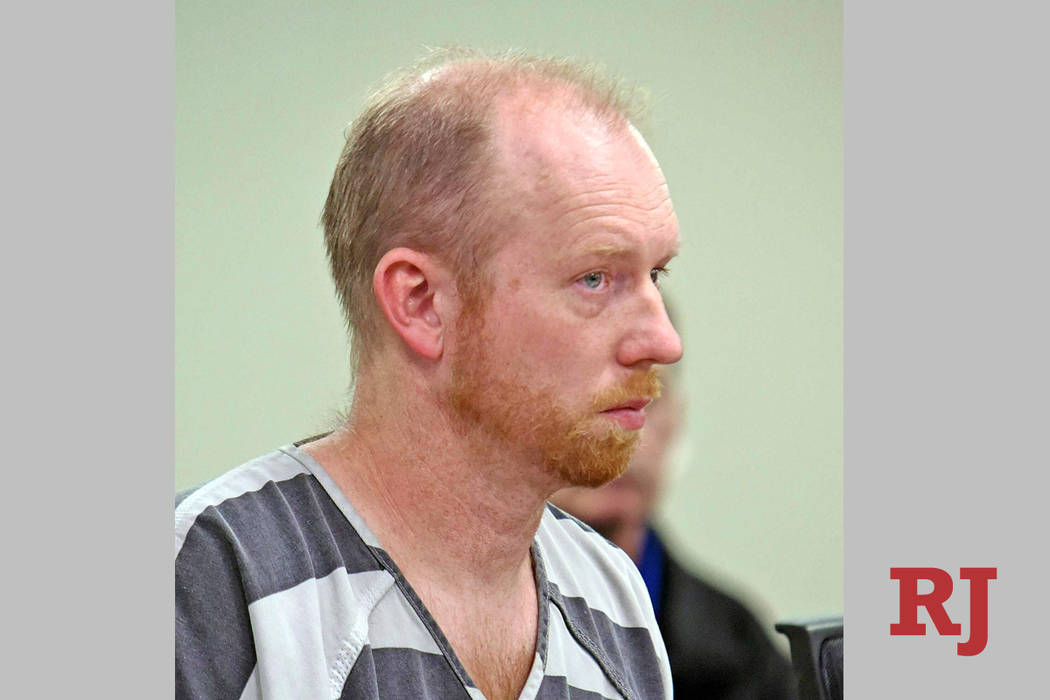 Chad Isaak listens while being charged with four counts of class AA felony murder in district c ...