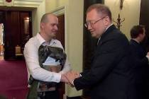 Russian Ambassador to the UK Alexander Yakovenko, right, shakes hands with Novichok poisoning v ...