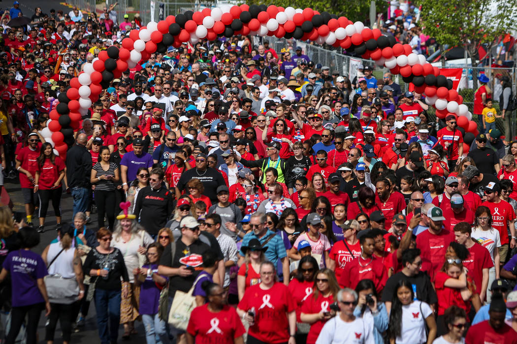 People participate in the 29th Annual AIDS Walk Las Vegas at Town Square in Las Vegas, Sunday, ...