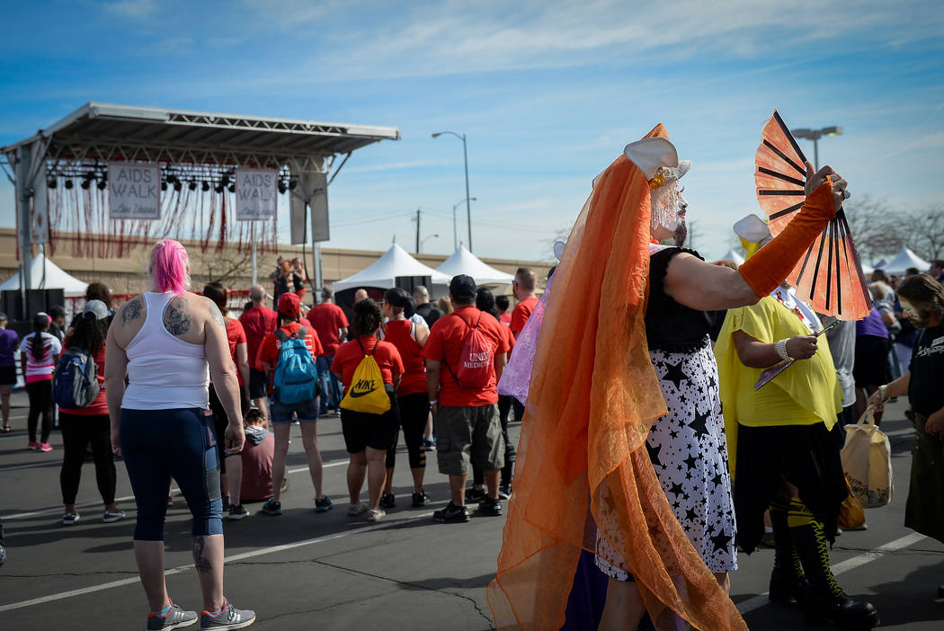 A man dressed in drag fans himself at the 29th Annual AIDS Walk Las Vegas at Town Square in Las ...